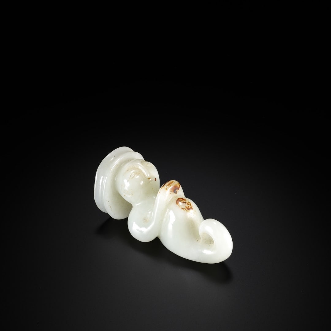 HAN HETIAN JADE KNEELING PENDANT: Length: 7.1cm(2.80in), Width: 3cm(1.18in), Thickness: 3.3cm(1.30in), Weight: 81g(0.179lb)Carved from Hetian nephrite. The figure takes the traditional ancient kneeling?and?sitting posture. Dressed in 
