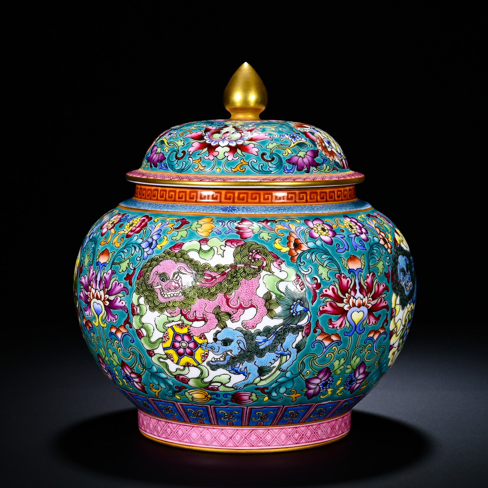QING QIANLONG PASTEL LOTUS AND LION PLAYING WITH HYDRANGEA PATTERN COVERED JAR: Height: 21cm(8.27in), Diameter: 16cm(6.30in)This is a Qianlong?period covered jar with turquoise?green ground, famille?rose scrolling?lotus and lions?playing?ball motif. The jar has a plump body toppe