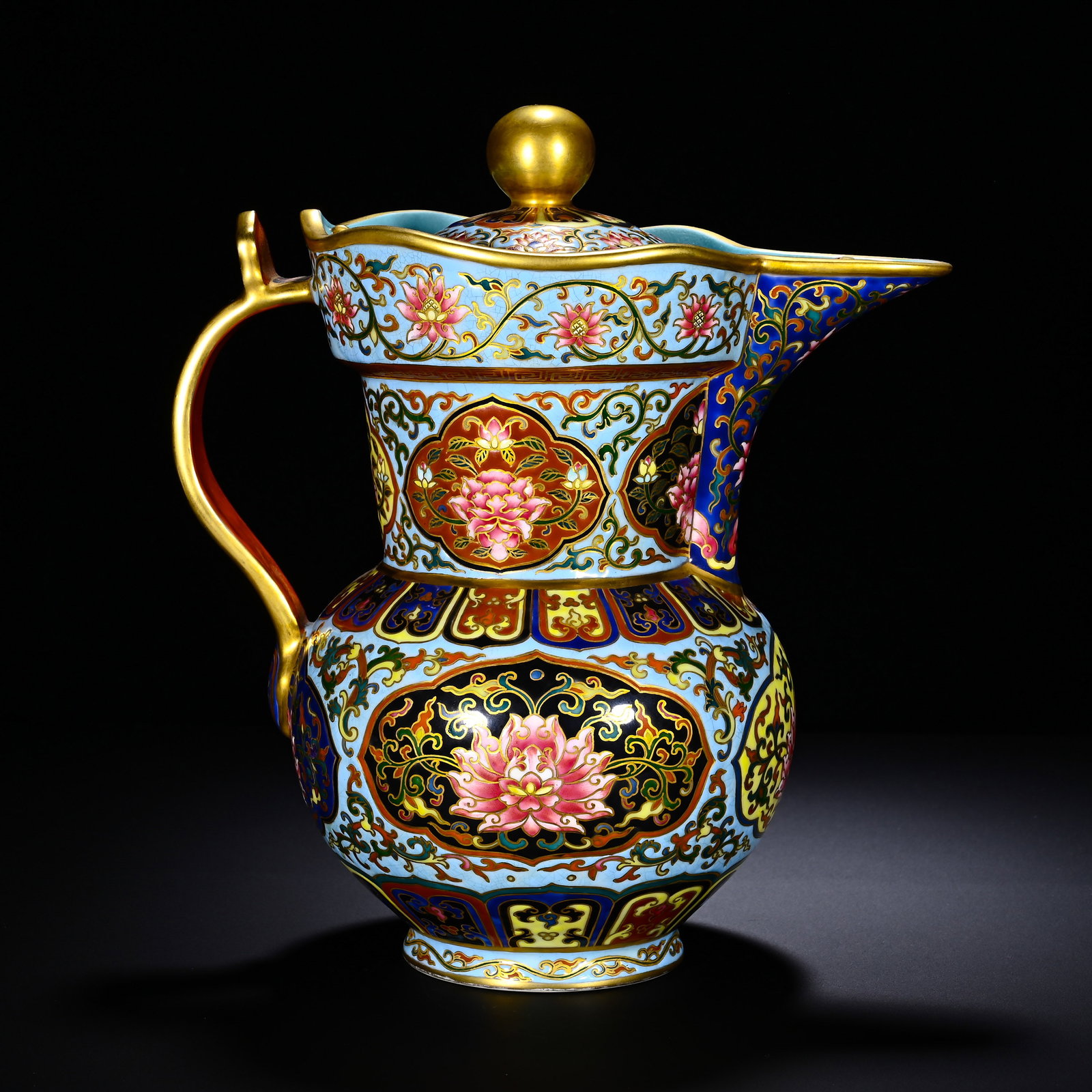 QING QIANLONG PASTEL ENAMEL IMITATION CLOISONNE LOTUS PATTERN MONK'S CAP VASE: Height: 26cm(10.24in), Width: 22cm(8.66in)Classic monk?cap?form ewer with jewel?knobbed cover, flared lobed rim, gilded handle and spout edge. Painted on pale?blue ground in famille?rose enamel simula