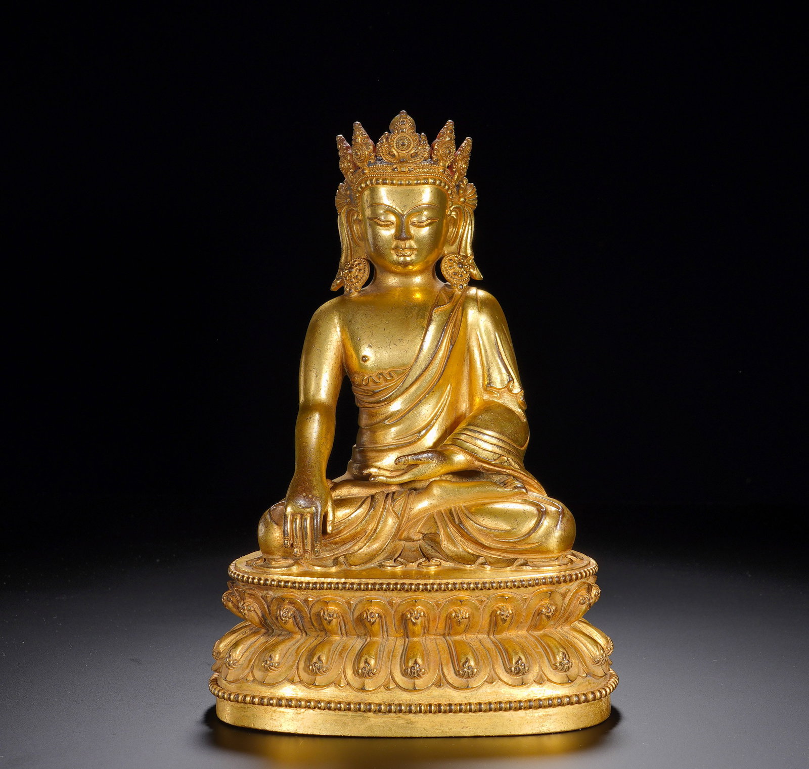 A GILDED BRONZE STATUE OF MANJUSRI BODHISATTVA WITH FOUR ARMS FROM YONGLE, MING DYNASTY: Height: 25cm(9.84in), Width: 17cm(6.69in), Weight: 2660g (5.864lb)Gilt Bronze Crowned Shakyamuni Buddha StatueThis gilt bronze crowned Shakyamuni sits in full lotus position upon a double lotus base. 
