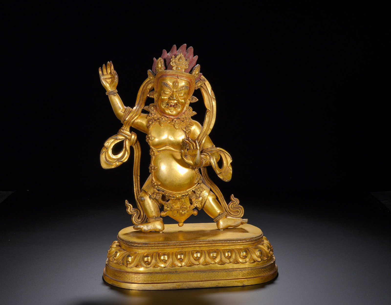 A GILDED BRONZE STANDING STATUE OF VAJRAPANI FROM THE MING DYNASTY: Height: 26cm(10.24in), Width: 22cm(8.66in), Weight: 2720g (5.997lb)Vajrapani, Lord of Secrets, is the wrathful emanation of Mahasthamaprapta. He embodies the power of all Buddhas, subduing negative fo