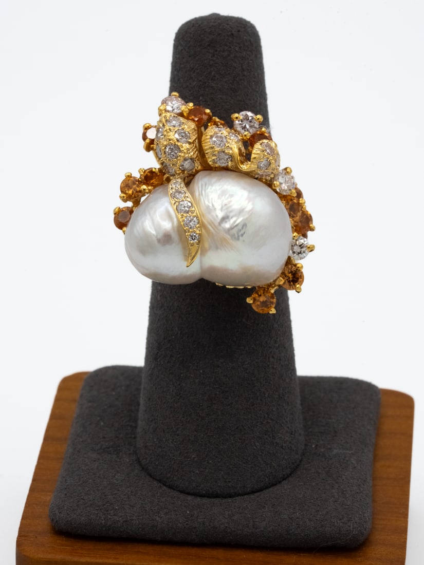 18K Yellow Gold Baroque Pearl & 1.50 TCW White and Yellow Diamond Statement Ring: An elaborate 18 karat yellow gold statement ring featuring two large baroque cultured pearls incorporated into a sculptural, organic-form mounting. The pearls display white body color with attractive 