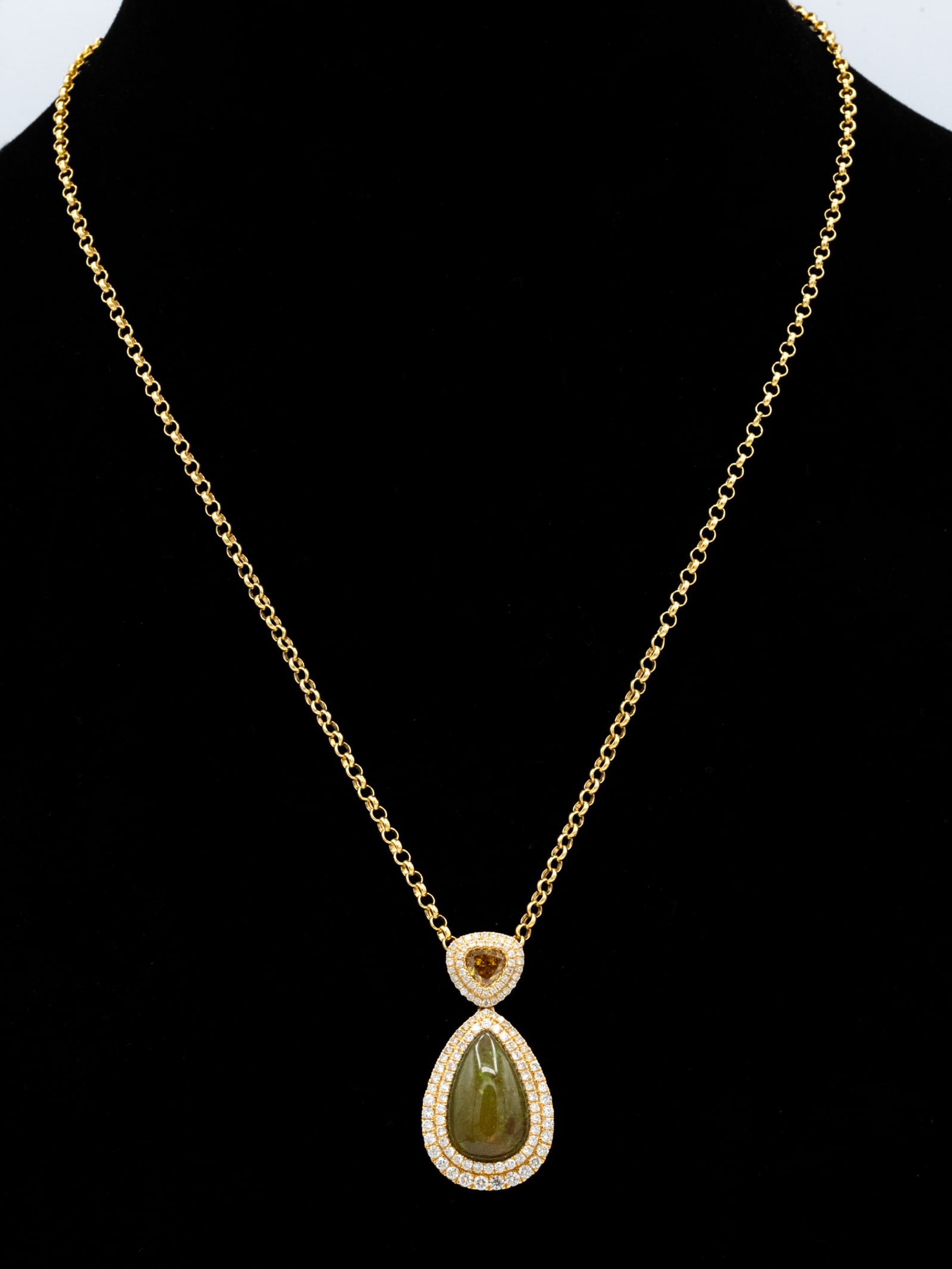 4.20 CT Opal, Colored Diamond & 1.60 CTW Diamond 14K Gold Pendant Necklace: A 14 karat yellow gold pendant necklace featuring a pear-shaped cabochon opal weighing approximately 4.20 carats. The opal displays a translucent greenish body appearance with subtle play-of-color vis