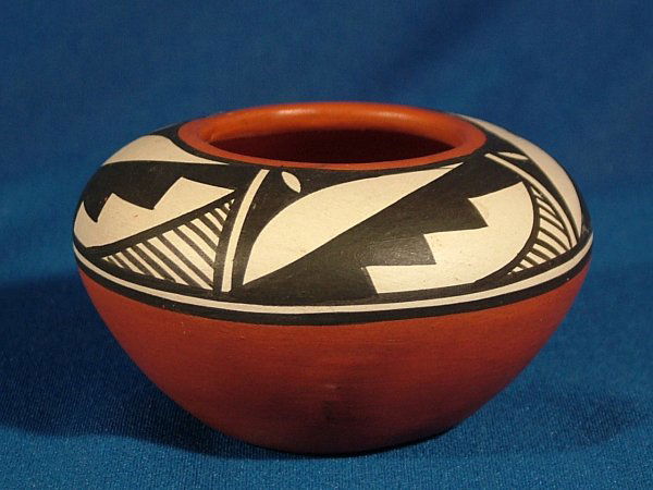 Native American Pottery - Navajo, Mary Saxon: Native American Pottery Bowl signed Mary Saxon Navajo. 2" tall. Free of chips, nicks or cracks.