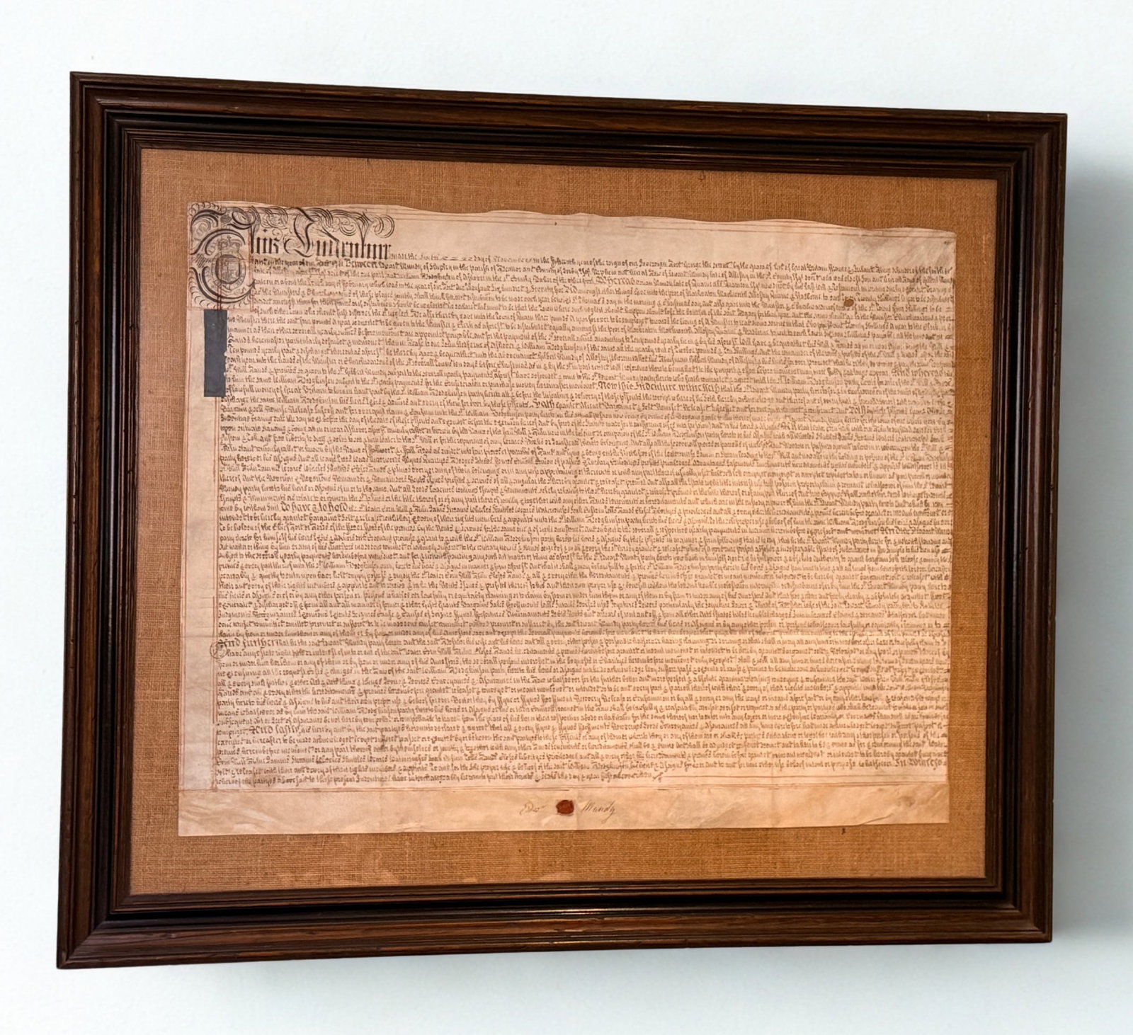 Antique English Vellum Indenture with Wax Seal: Framed Antique English Indenture on Vellum with Wax Seal Large antique English indenture hand-written in dark ink on vellum (animal parchment), beautifully executed in period secretary hand. The docum