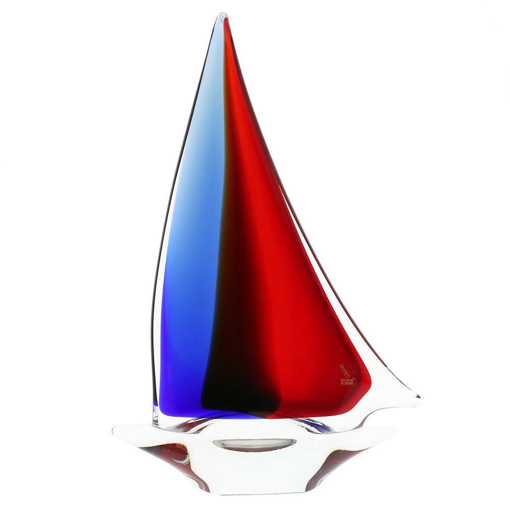 Murano Glass Large Sailboat - Red Blue Amber: You can feel the salty air, imagine the far-away fishing villages, and get immersed in the ever-changing nature of the sea when you look at this beautifully handcrafted Murano Glass sailboat. The gorg