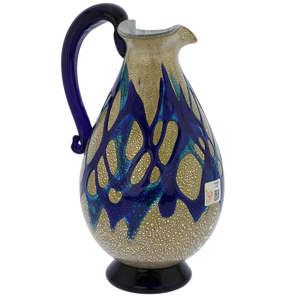Murano Glass Silver Pitcher/ Carafe - Blue Web: This one-of-a-kind Murano Pitcher born in the fire of the famous ancient Murano Glass furnaces features elegant artistic form and gorgeous colors. The unique design of sparkling silver foil base wrapp