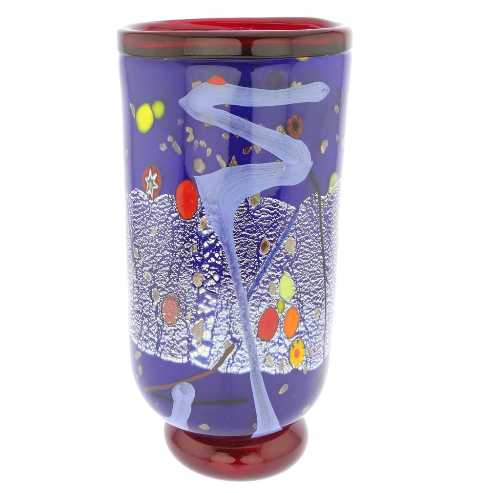 Murano Glass Modern Art Vase - Blue: The bold design and rich colors of this Murano Glass Vase accented by the shimmering silver leaf infused in the glass make it an instant conversation piece. Crafted by famous glass artists in a tradit