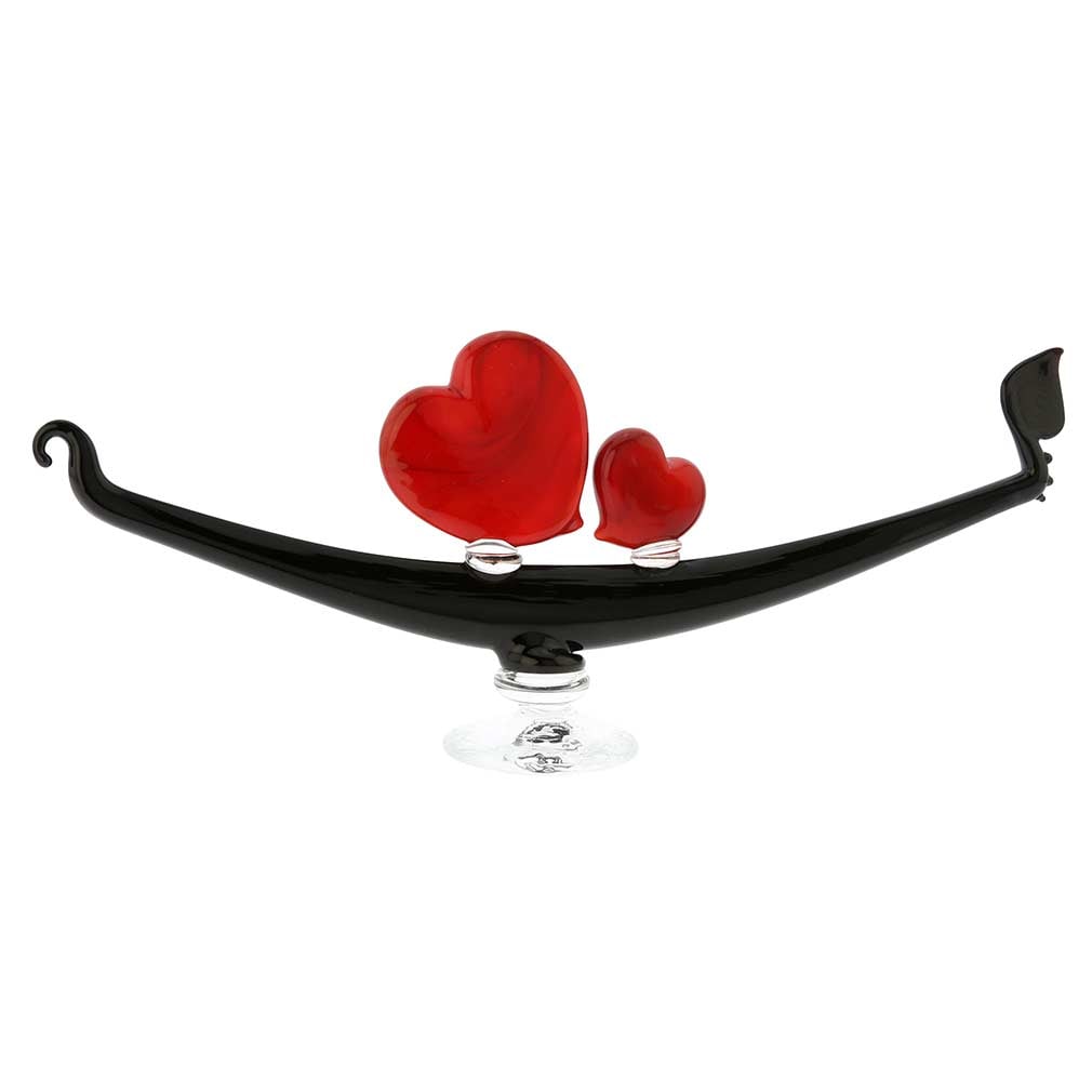 Murano Glass Romantic Hearts Gondola: The city of romance, love, and passion, Venice has always been a magnet for lovers and romantics at heart. With its quiet canals, beautiful palaces and narrow medieval alleys, Venice is a perfect plac