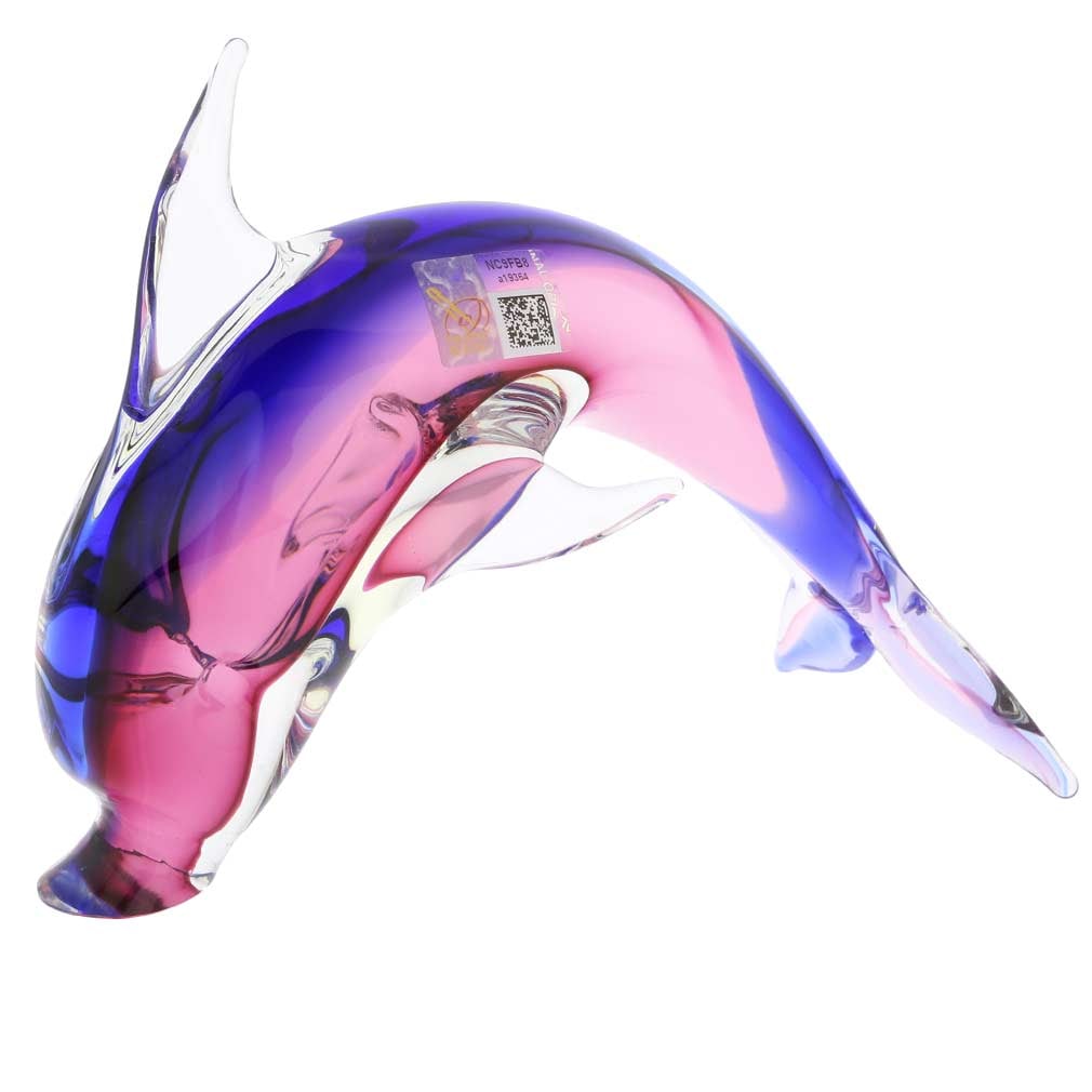Murano Glass Dolphin - Rose and Blue: This playful Murano Glass Dolphin is ready to jump into the waves, conjuring up the images of exotic seas and beautiful faraway lands. Created in famed Sommerso glass-making technique invented on Mura