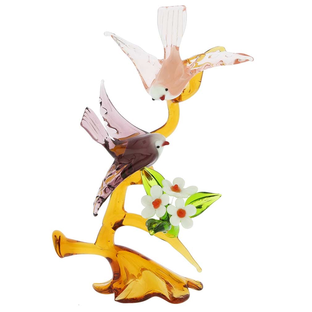 Murano Glass Birds On a Tree With Flower - Purple and Pink: This gorgeous Murano glass sculpture channels Venetian romance and exquisite beauty, symbolized by the two birds leaning close to each other on a tree branch. Fabulous colors, transparent nature of th