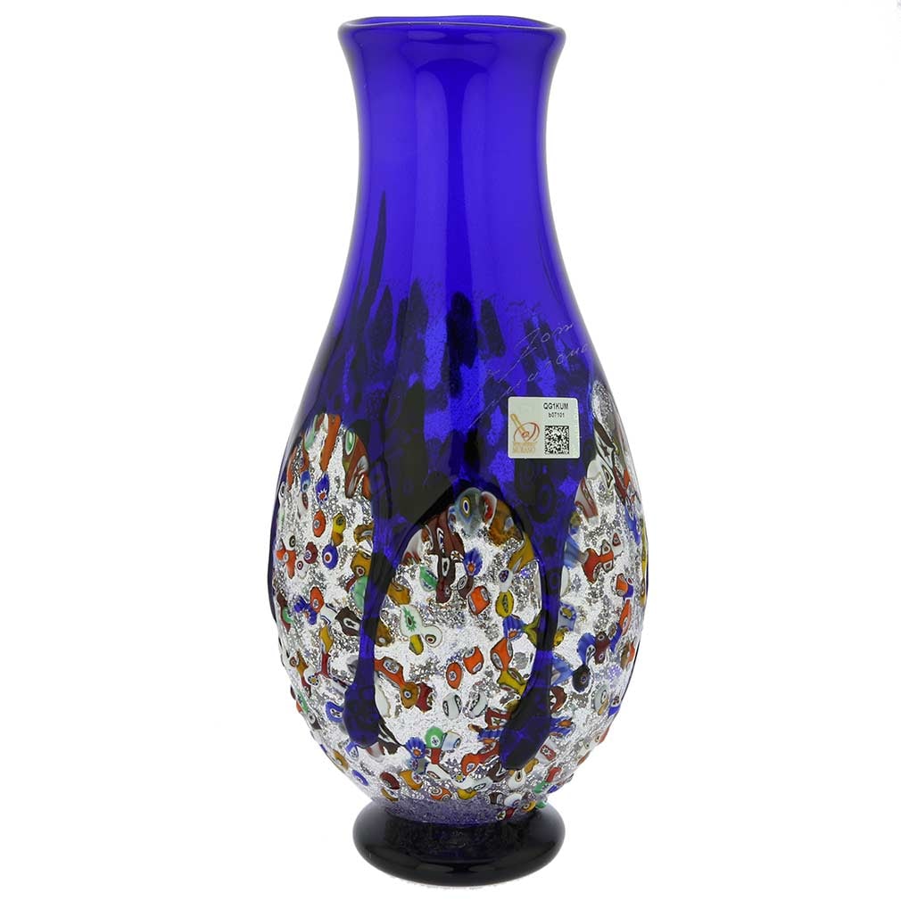 Murano Glass Millefiori Art Glass Bottle Vase - Blue: This magnificent blown Murano Glass vase features elegant design, deep colors, and exquisite detail - the key characteristics of the work of famed Murano Glass masters. Like a splash of precious stone