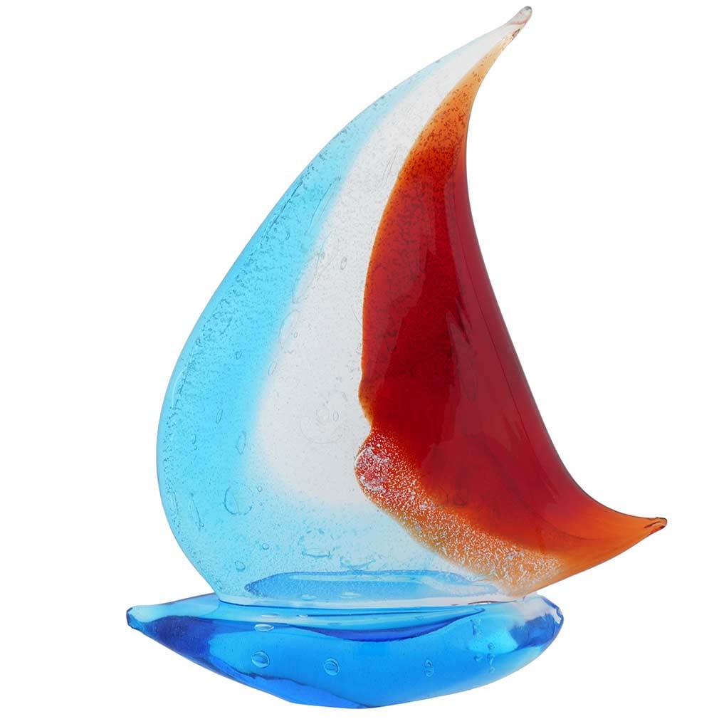 Murano Glass Large Sailboat - Silver Blue and Red: Hear the siren call of the faraway seas when you look at this beautifully handcrafted Murano Glass sailboat with its fluttering headsail in tender blue and rich red colors. This exquisite Venetian boa