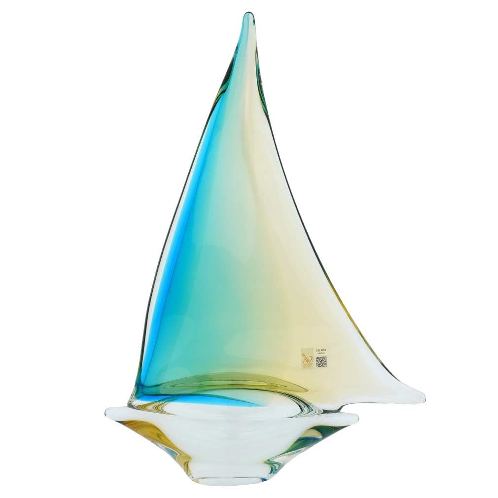 Murano Glass Large Sailboat - Amber Aqua: Feel the salty air, imagine the far-away lands, and get immersed in the ever-changing beauty of the sea when you look at this gorgeous handcrafted Murano Glass sailboat. The graceful boat proudly disp