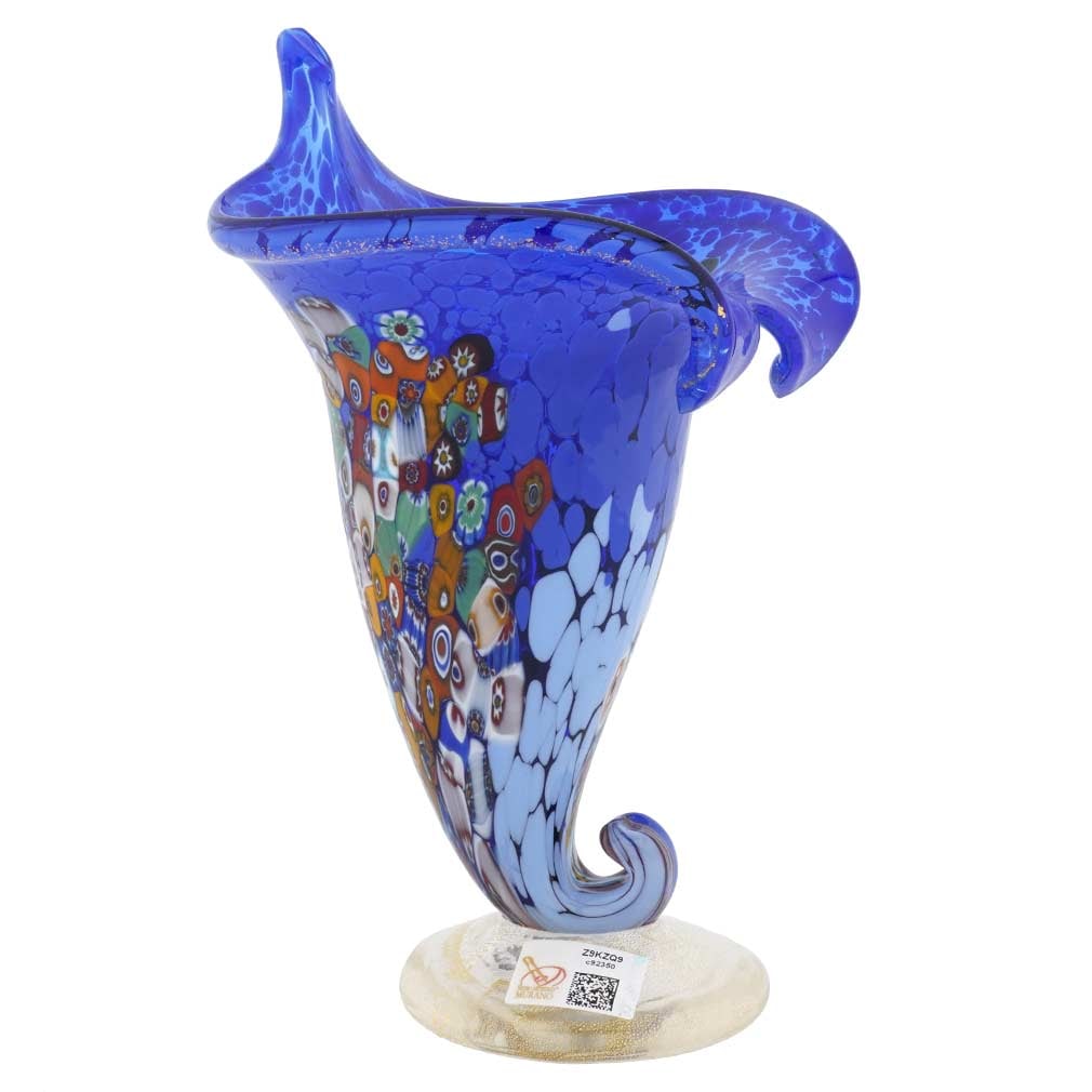 Murano Glass Millefiori Horn Of Plenty Vase - Blue: This gorgeous Murano Glass Vase is not only a beautiful piece of art but a meanigful symbol cherished in Western Art, a Horn Of Plenty. With its connotation of abundance, prosperity, and good fortune,