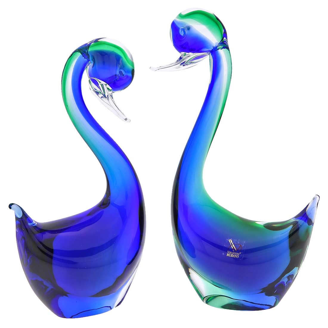 Murano Glass Swans Family - Pair: A symbol of romance, love, and commitment, this stunning pair of deep blue and emerald-green Murano Glass swans is a delightful sculpture to display at home or give as a gift. Created in Sommerso glas