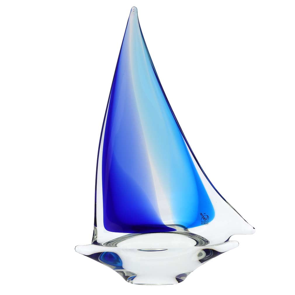 Murano Glass Large Sailboat - Aqua Blue: Feel the salty air, imagine the far-away lands, and get immersed in the ever-changing beauty of the sea when you look at this gorgeous handcrafted Murano Glass sailboat. The graceful boat proudly disp