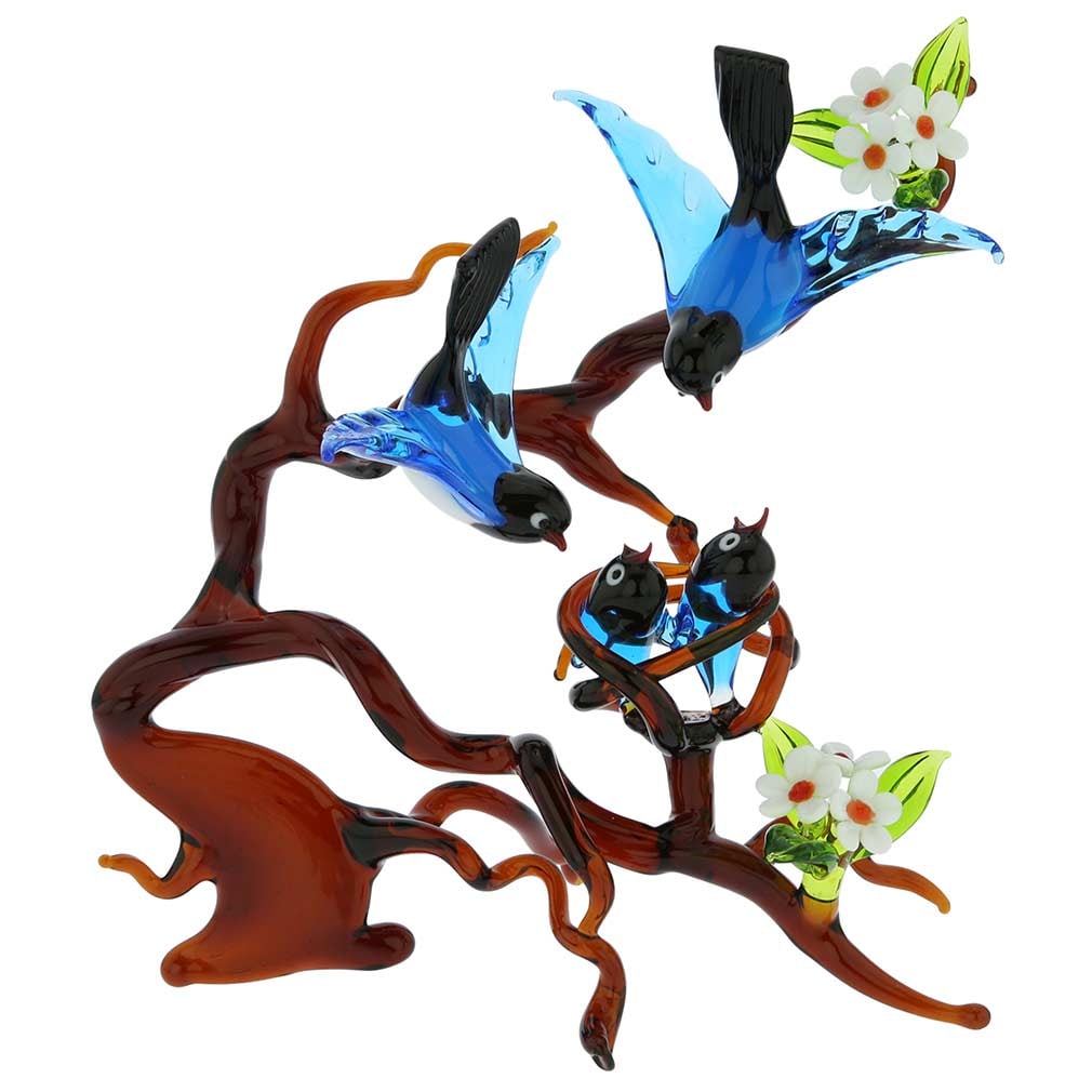 Murano Glass Birds on a Branch with Nest - Blue: You cannot help but imagine yourself in one of Venice's enchanted gardens lulled by the bird song and dazzled by the harmony of man-made beauty and nature when you set your eyes on this meticulously c