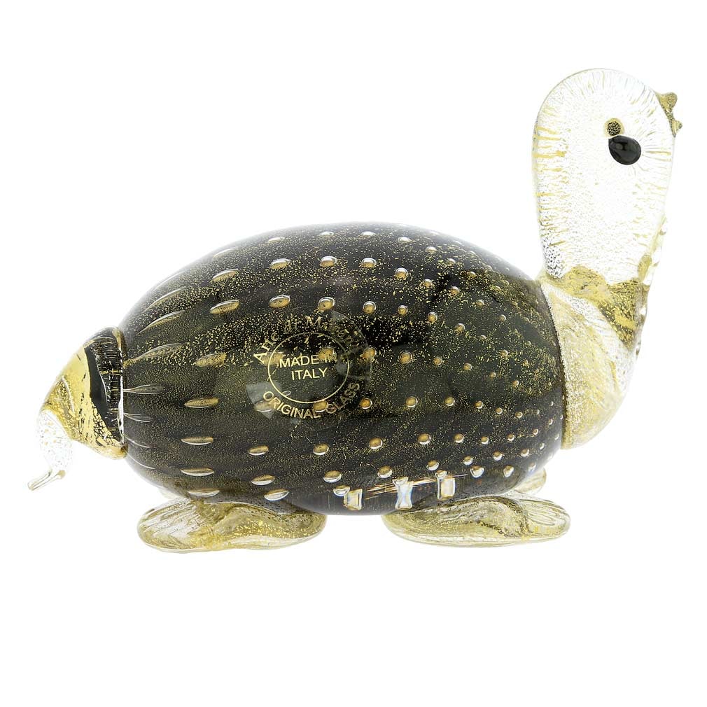 Murano Glass Bullicante Turtle - Black: This cute Murano Glass Turtle in rich black color and 24 karat gold accents is a charming sculpture which would enhance any home decor style, whether contemporary or classic. Handcrafted by the top gl