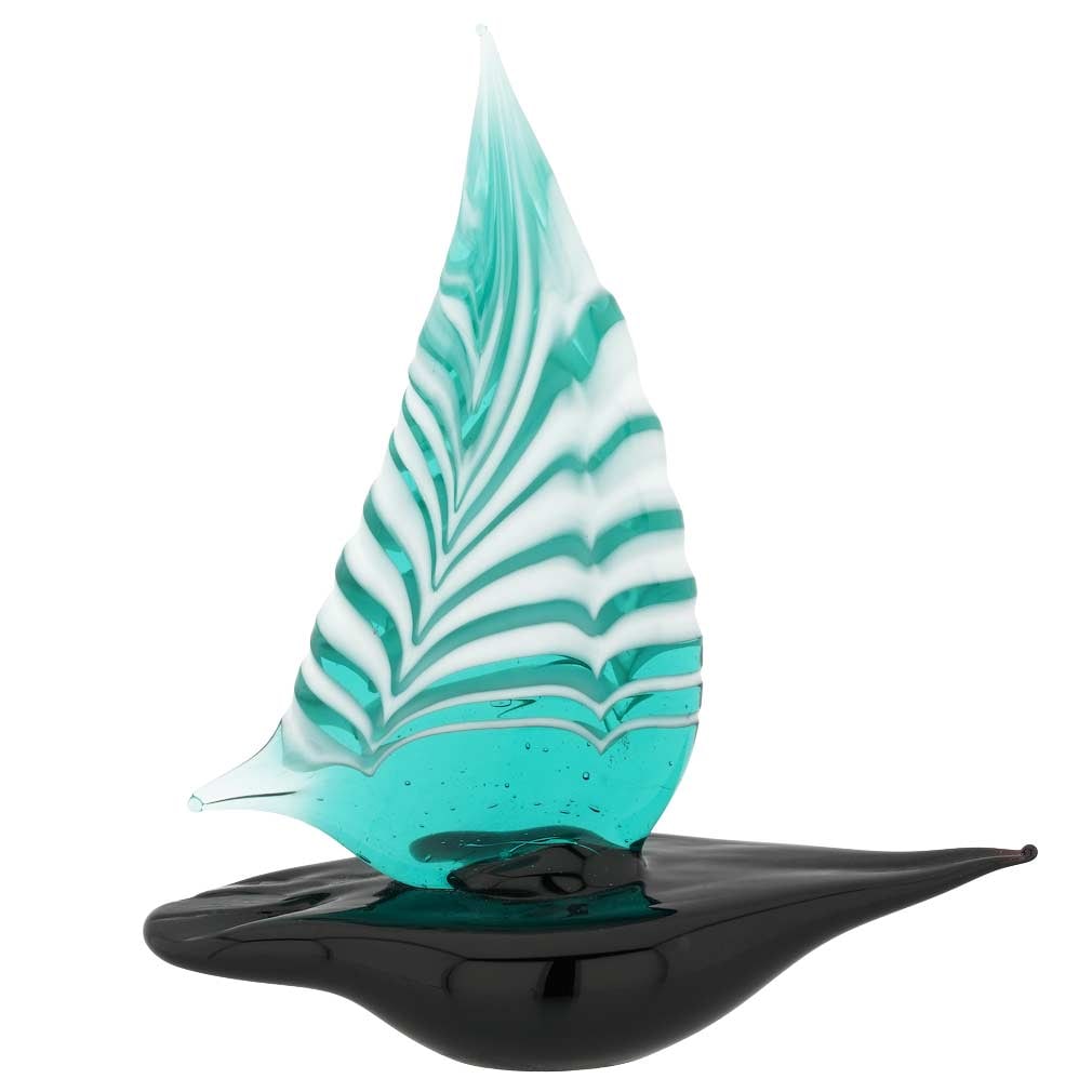 Murano Glass Small Sailboat - Ocean Green: Feel the salty air, imagine the far-away lands, and get immersed in the ever-changing beauty of the sea when you look at this exquisite handcrafted Murano Glass sailboat figurine. The graceful boat pr
