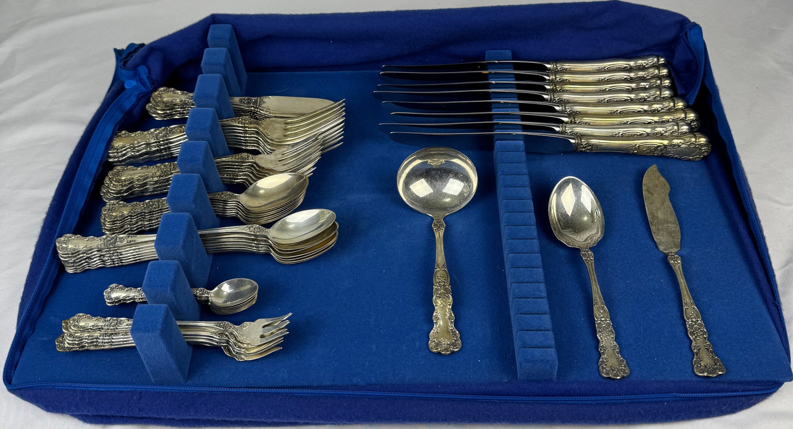 Buttercup by Gorham Sterling Silver DInner Flatware set for 8 service 66 Pieces: Intricately carved floral motifs carefully arranged along the handle and by the neck of this fanciful pattern are balanced by a slender central panel edged with delicate borders. Introduced in 1899,