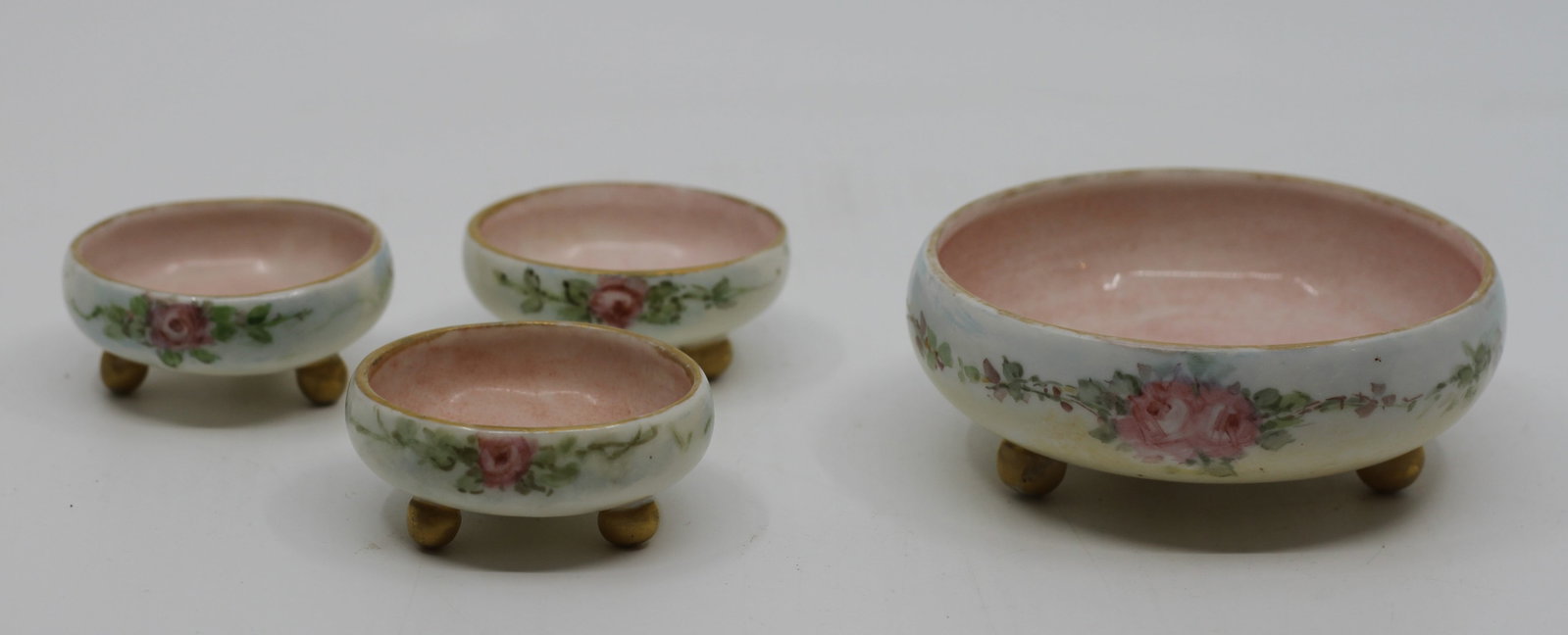 Mz Austria Hand Painted Porcelain Individual Footed Dishes, Set of 4: Vanity dishes features a delicate pink rose floral pattern. MZ Austria mark was used from 1884 to 1909 by the Moritz Zdekauer Bank. 9 x 3.5 cm (large), 5 x 2.5 cm (small)
