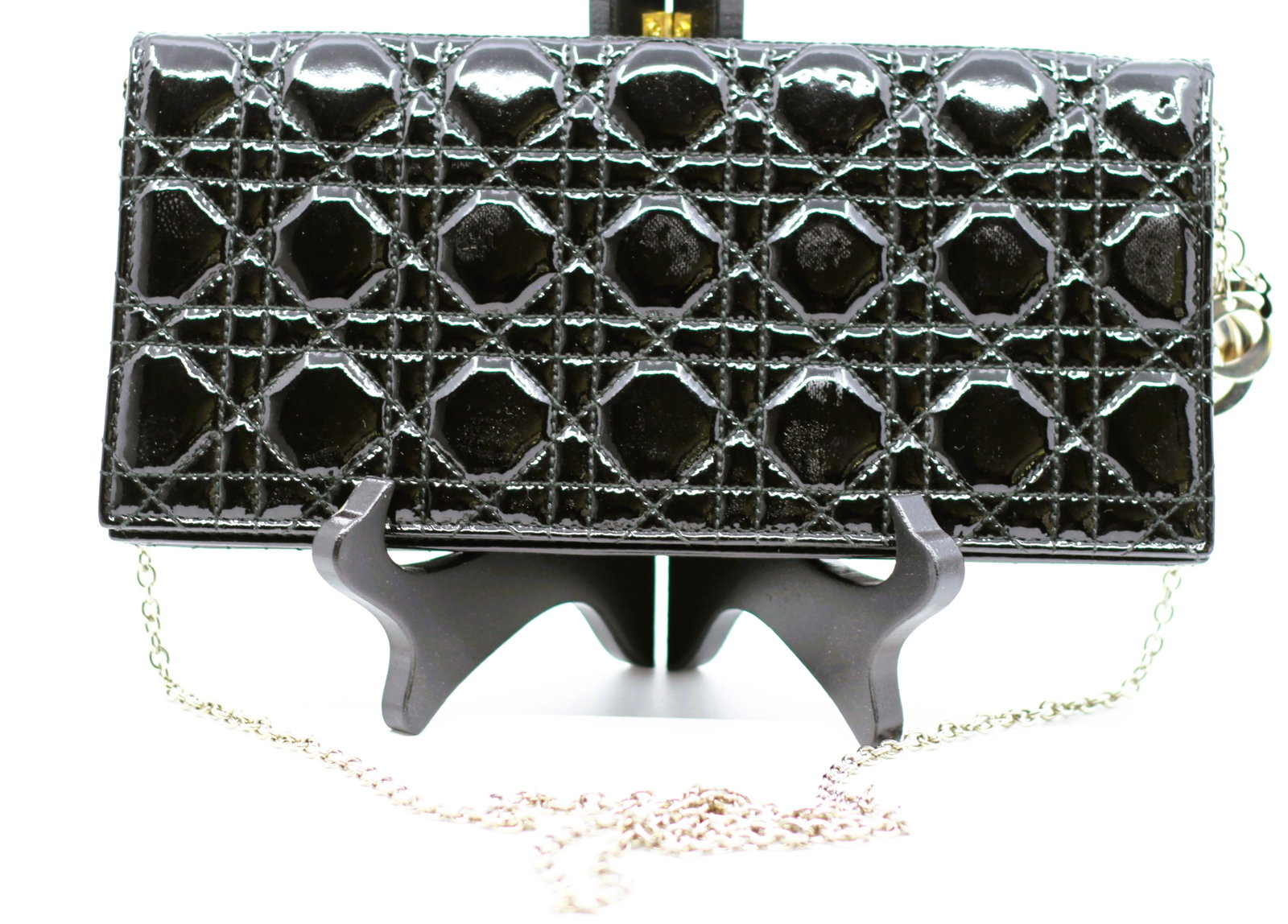 Christian Dior Black Cannage Patent Leather Wallet on Chain Evening Clutch: Elegant Christian Dior wallet on chain crafted in glossy black patent leather featuring the iconic Cannage quilted pattern. The timeless design is complemented by a polished silver-tone chain shoulder