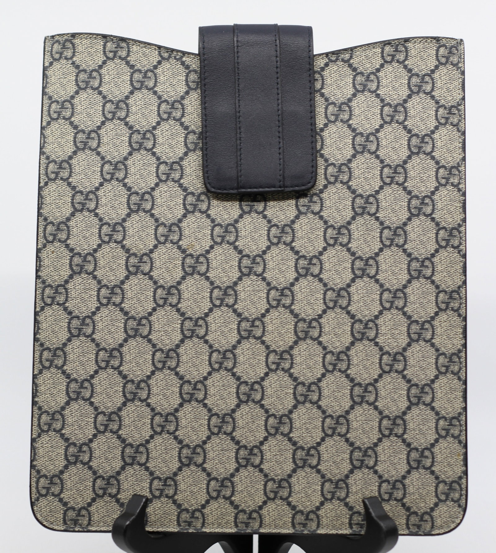 Gucci GG Supreme Canvas & Black Leather Tablet Sleeve / Document Case: Classic Gucci tablet sleeve or document case crafted in the iconic beige and ebony GG Supreme coated canvas with black leather trim and a secure leather flap with hook-and-loop (Velcro) closure. The s