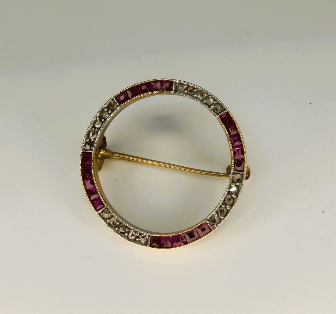 Antique 14K Gold Ruby & Rose Cut Diamond Circle Brooch: An elegant antique circular brooch crafted in 14K yellow gold with a refined white gold or platinum-topped front, showcasing alternating calibre-cut synthetic rubies and rose-cut diamonds in a timeles