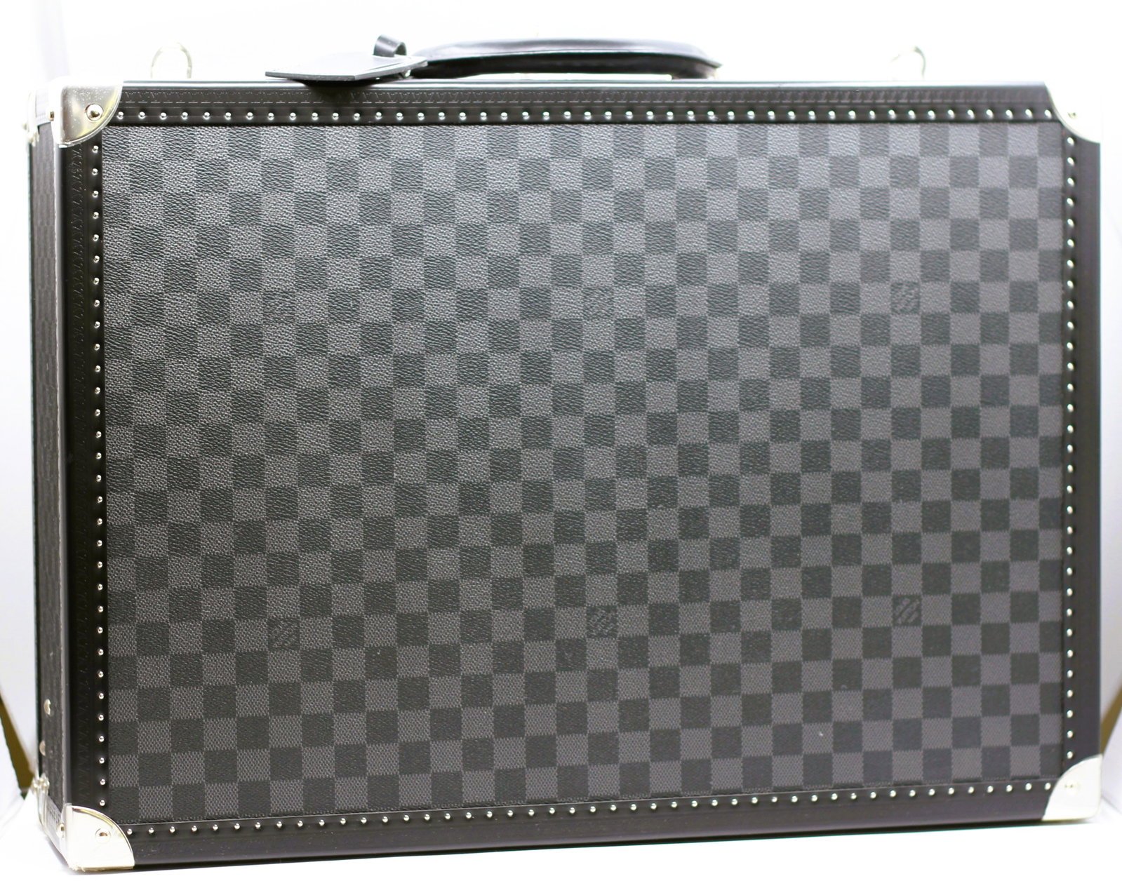 Louis Vuitton Bisten 55 Damier Graphite Hard-Sided Suitcase Trunk: Louis Vuitton Bisten 55 hard-sided suitcase in signature Damier Graphite coated canvas. Features black leather trim and rounded leather handle, silver-tone brass corner protectors, riveted edging, cen