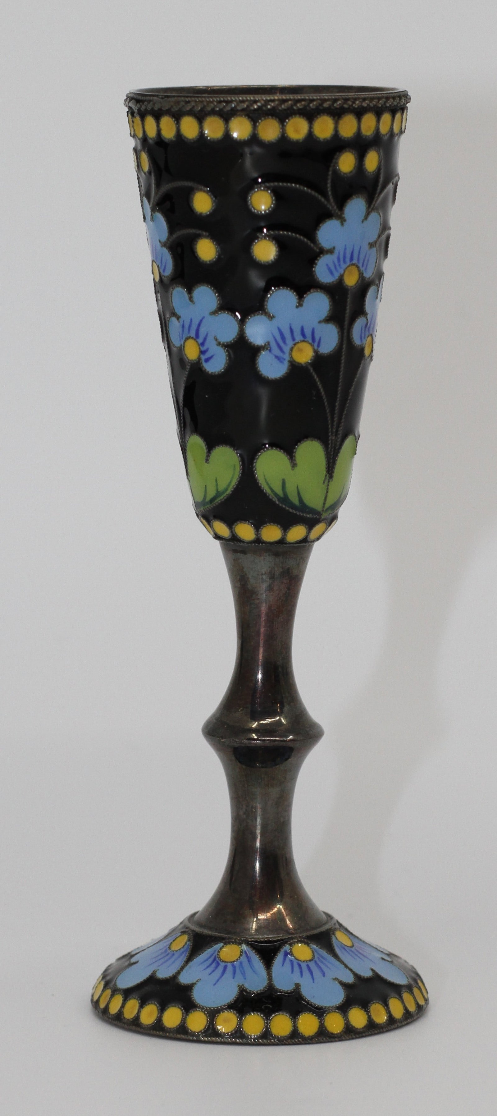 Russian 84 Silver Cloisonne Enamel Goblet: Antique Russian silver goblet decorated with cloisonne enamel floral motifs in blue, yellow, green and black. Gilt interior. Marked 84 silver standard with additional maker mark.