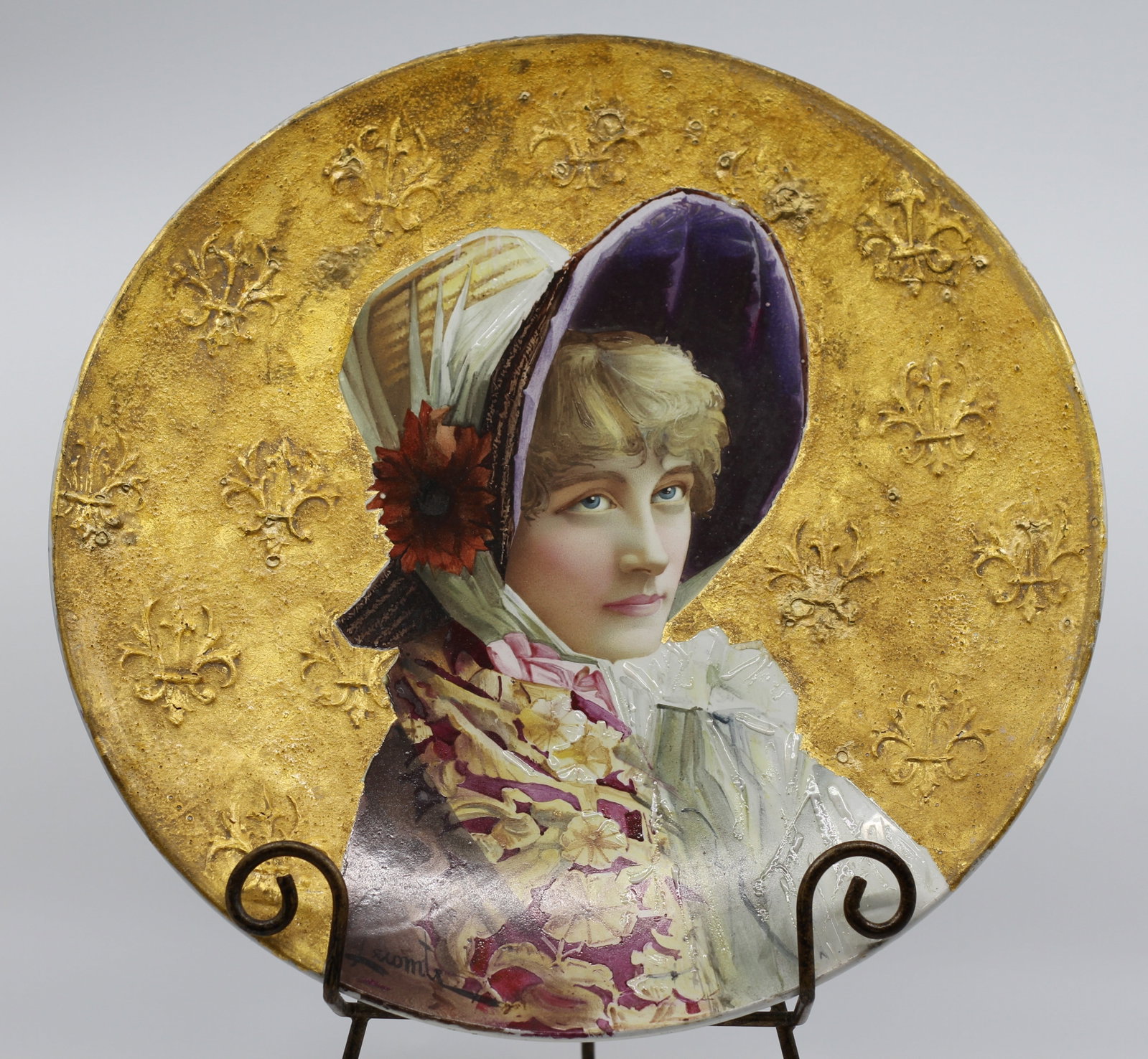 Lecomte Signed Montereau French Porcelain Portrait Plaque: Antique French hand painted porcelain cabinet plate depicting a fashionable young woman in bonnet and floral shawl against a textured gilt ground. Signed Lecomte lower left. Reverse marked Montereau B