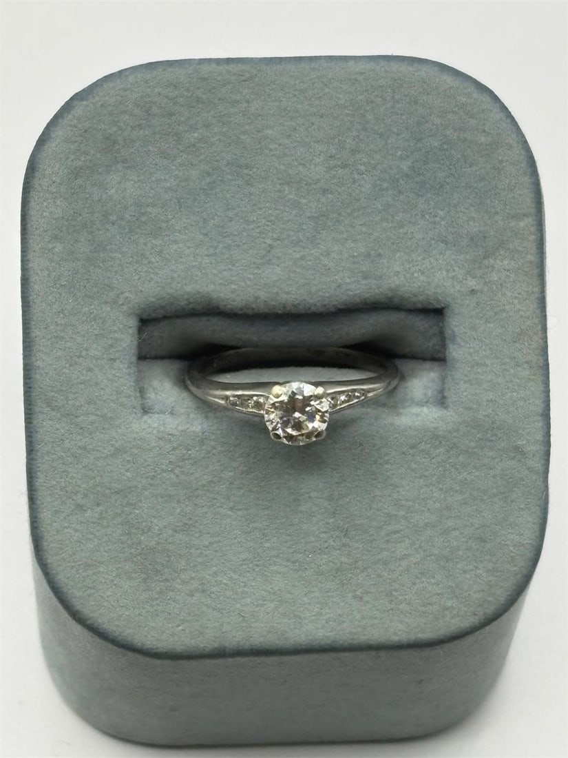 Old European Diamond and Platinum Ring: 3.1 g, Center Diamond 5.6 MM Diameter Old European Cut, Side Diamonds: 6, Platinum Setting, Size 6 3/4, NOTE: Lot 11 is the matching wedding band