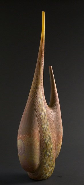 "Temitope" by Davide Salvadore: Blown and engraved glass. Dimensions 40H x 14W x 8D Davide Salvadore was born into a glassmaking family on the island of Murano where he still lives and works today. His blown and engraved vessels hav