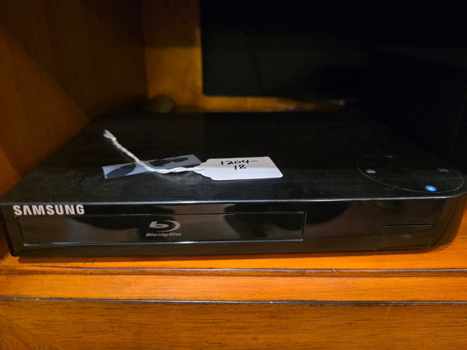 Samsung Blu-ray player: This player has touch technology. Just touch the top of the player for it to open. It still works.