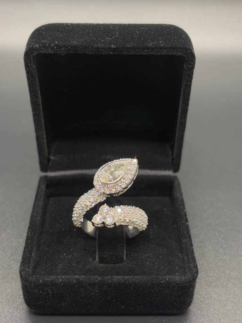 Pear Lab Diamond Bezel Ring 18K Gold: Exquisite 18KT White Gold Ring with a unique bezel/bead setting, showcasing a brilliant 1.01ct Pear Brilliant Cut Lab Grown Diamond elegantly wrapped and accented by 110 Round Brilliant Cu