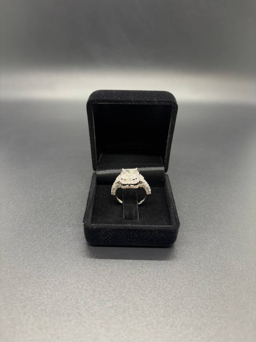 VVS2 Emerald Cut Lab Diamond Ring 18K Gold: Breathtaking 18KT White Gold Halo Ring centred with a sophisticated 2.01ct Emerald Cut Lab Grown Diamond of exceptional colour grade D, elegantly framed by 124 Round Brilliant Cut Lab Grown Diamonds