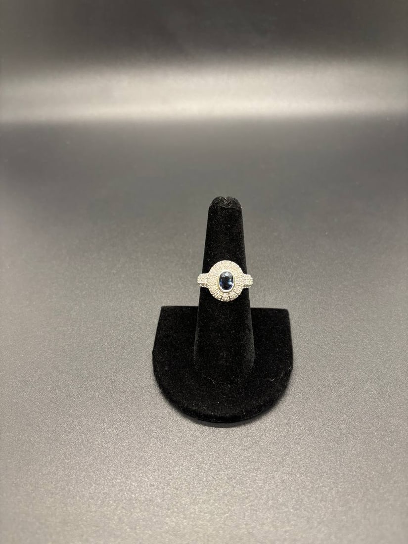 Natural Blue Sapphire Lab Diamond 18K Ring: Magnificent 18KT White Gold Ring featuring a vivid 1.062ct Oval Shaped Natural Blue Sapphire as its captivating centrepiece, luxuriously surrounded by 98 Round Brilliant Cut Lab Grown Diamonds in an