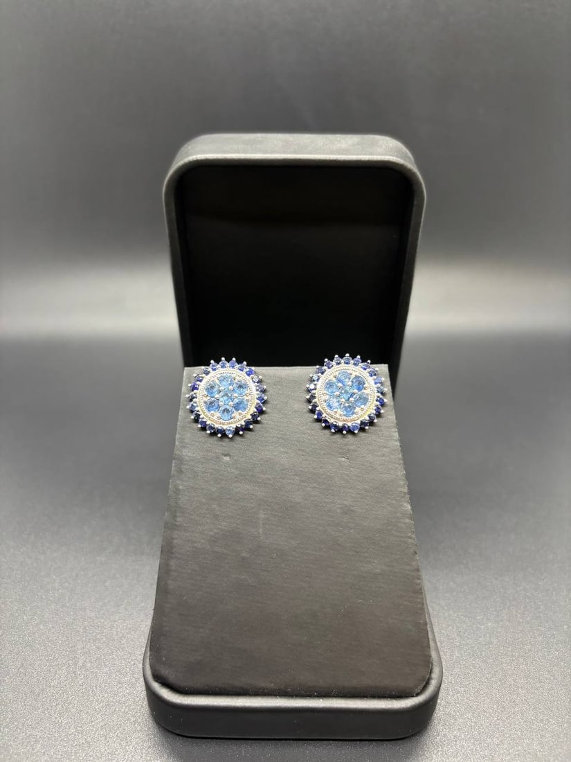 Blue Sapphire Cluster Stud 18KT Earrings: Refined and eye-catching 18KT White Gold Custom Cluster Stud Earrings masterfully crafted with 58 Round Shaped Natural Blue Sapphires totalling 5.863ct, arranged in a breathtaking floral cluster