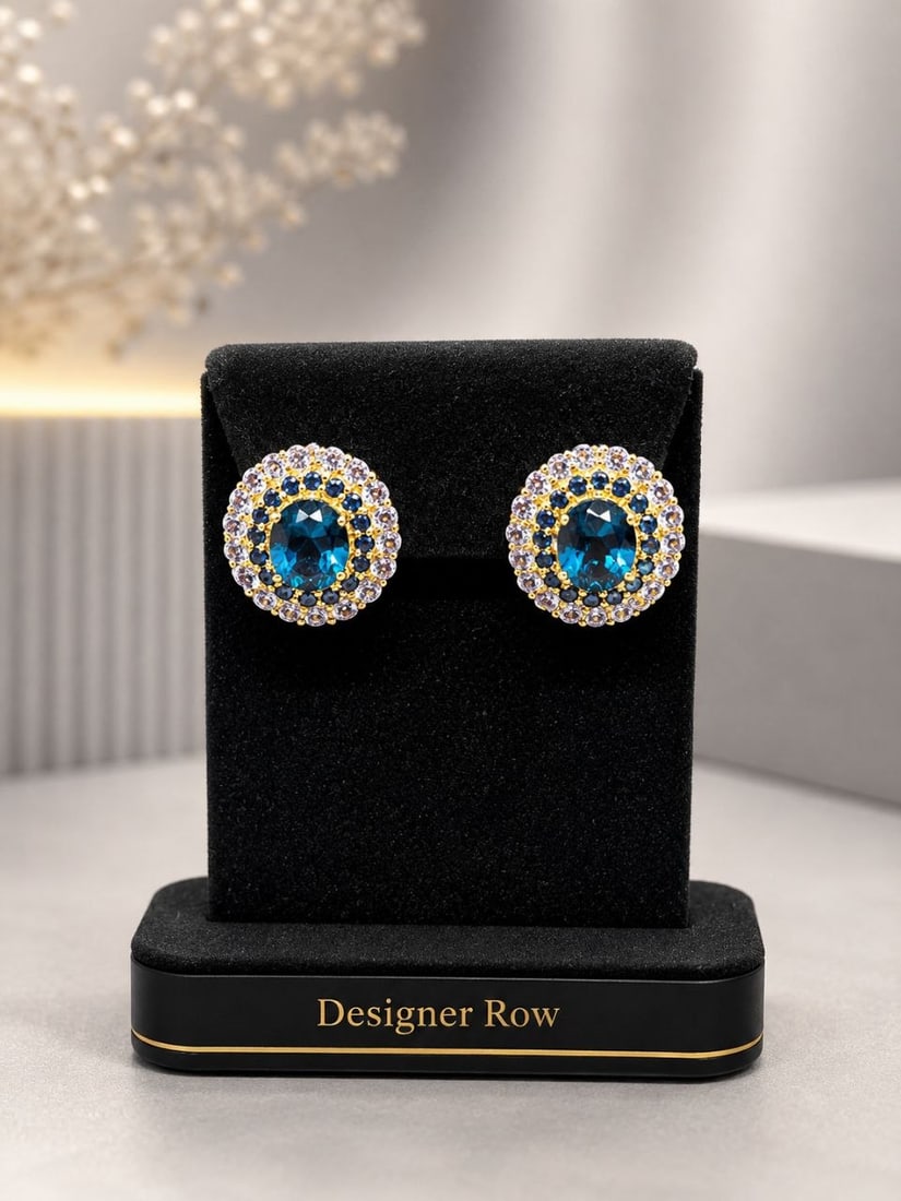 London Blue Topaz Sapphire Halo Earrings: NOTE: Additional lots may be added until the final day of the auction. Please check back regularly for updates and newly added items. Deep and dazzling, these round stud earrings feature rich London B