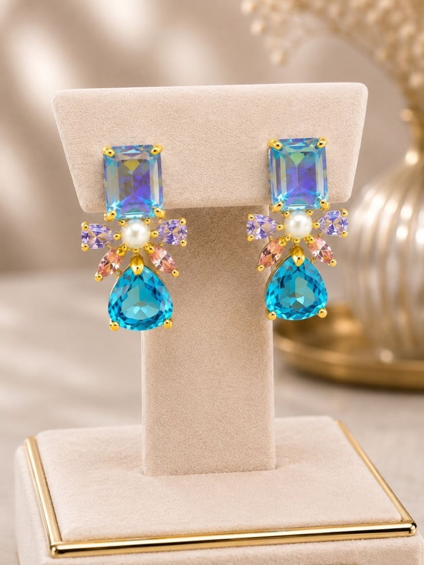925 Silver Mystic & London Topaz Earrings: NOTE: Additional lots may be added until the final day of the auction. Please check back regularly for updates and newly added items. A stunning pair of custom drop earrings featuring an elegant combi