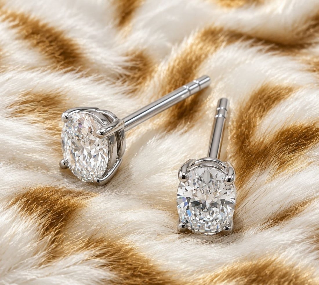 18K White Gold Oval Diamond Earrings: NOTE- Additional lots may be added until the final day of the auction. Please check back regularly for updates and newly added items. Graceful and timeless, these elegant 18K White Gold earrings