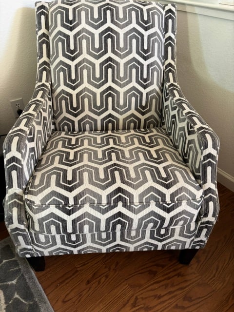 Ashley Furniture Gilmer Accent Chair - Gunmetal Gray: Gilmer by Ashley FurnitureBringing a decidedly modern mood to your space, the chic Gilmer accent chair is dressed to impress with slim, sloped arms and a vibrant graphic balanced by understated hues. 