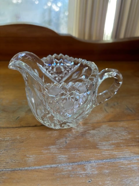 Vintage American Brilliant Cut Glass Pinwheel Hobstar Creamer: Vintage American Brilliant Cut Glass Pinwheel Hobstar CreamerThis vintage cut glass creamer boasts intricate patterns, adding elegance to any dining or entertaining setup. Durable and timeless.• 