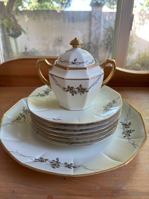 Vintage Johann Haviland "Sepia Rose" china featuring brown floral motifs, gold trim -set: The set includes a lidded sugar bowl with handles and stacked plates.Johann Haviland produced this porcelain in Bavaria, Germany, often in the 1940s.One platter - 12"6 small plates - 7.5"Sugar bowl - 