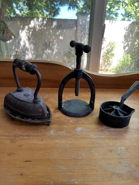 Antique Cast Iron Juicer, Antique Iron, Curling Iron and Sifter: Juicer: This is an antique cast iron juicer or citrus press. This Columbia Meat Juice Press was made in the late 1800s by the Landers, Frary & Clark company in New Britain Connecticut. The cast iron p