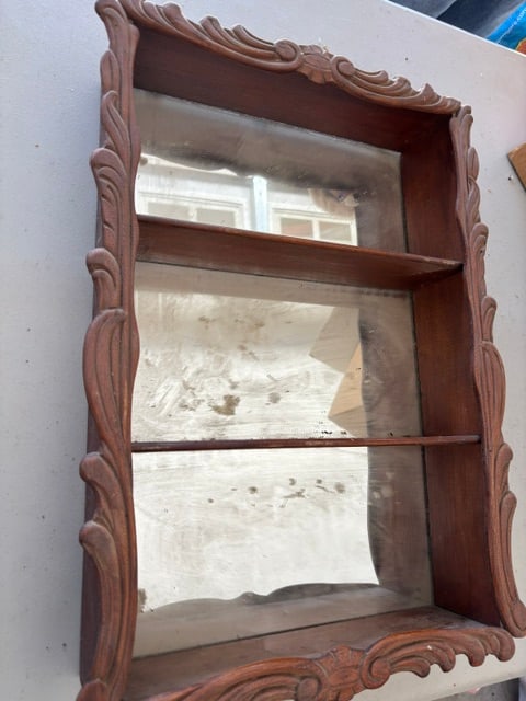 Vintage streak mirrored CURIO SHELF CABINET 11.5” x 14” Decorative bordered: VINTAGE WOODEN CABINET CURIO SHELF , with 3 SHELVES (counting bottom one. Decorative edges, shelves are wood. Inside back is a cloudy mirror. Measures about 11.5" x 14.5” across door, back box f