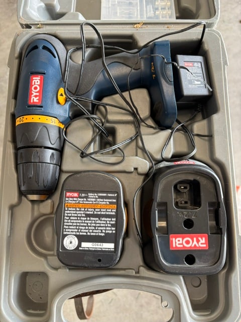 RYOBI HP472 7.2V CORDLESS DRILL/DRIVER SET: This is a Ryobi HP472 7.2V cordless drill/driver set featuring a blue and yellow housing.The kit includes a charger and at least one 7.2-volt battery.It comes in a durable plastic carrying case for st
