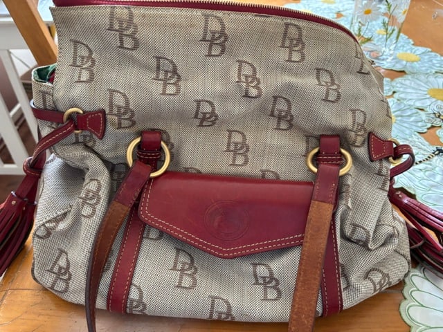 Dooney & Bourke Florentine Jacquard THE SMITH Bag: This is a Dooney & Bourke Signature Florentine Jacquard "The Smith" satchel bag featuring a beige monogram pattern and red leather trim.