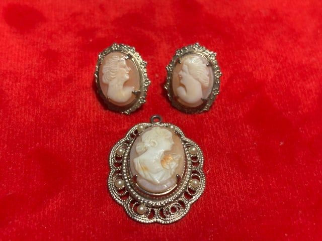 Vintage Gold Tone Cameo Pendant and Earrings Set: Very good used vintage condition. Size: 1.5" pendant and 1" earrings. Pictures are of the real item. Pendant has a blemish